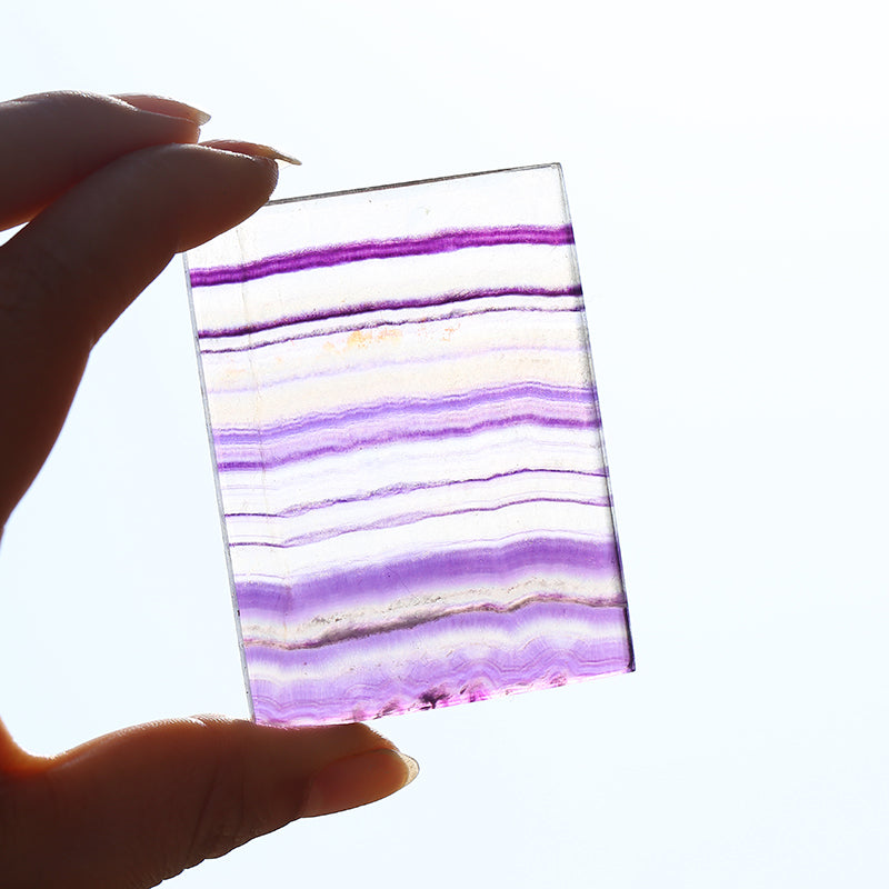 Rainbow fluorite crystal slice is pendant