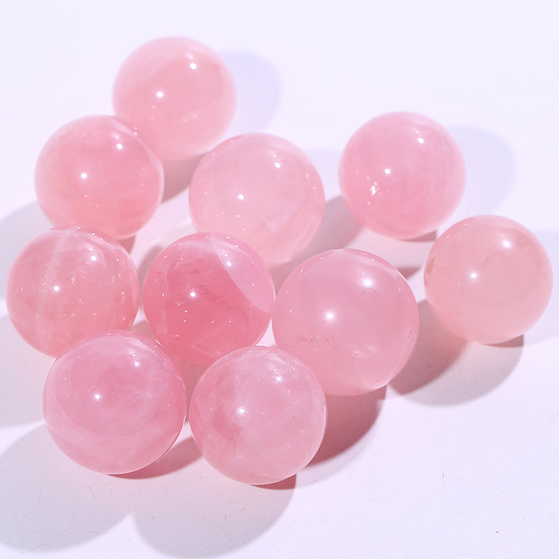 Bola de cristal con forma de piedra rosa 1kg