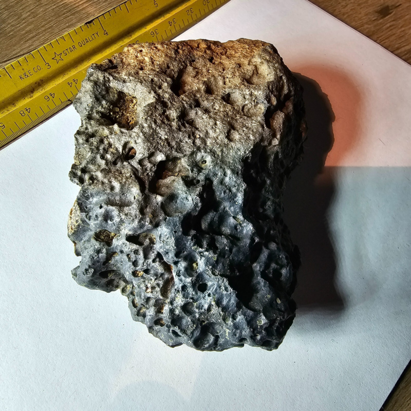Meteorite rock item is a pitted unknown from Mohave desert 10.75- sample stone.