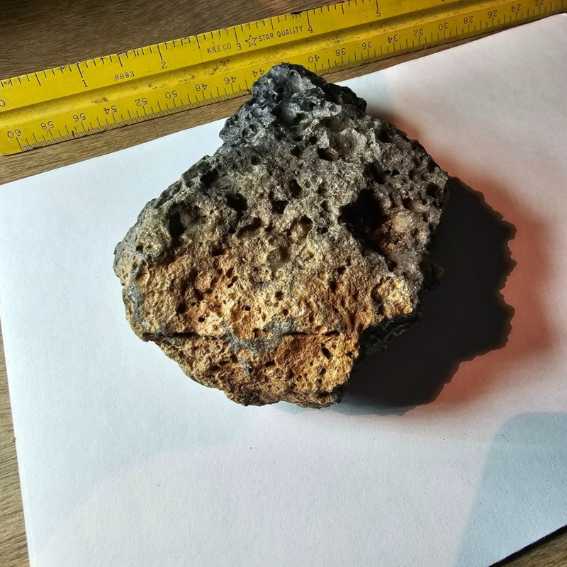 Meteorite rock item is a pitted unknown from Mohave desert 10.75- sample stone.