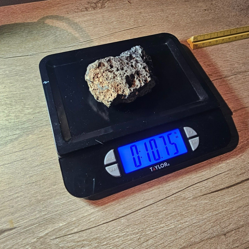 Meteorite rock item is a pitted unknown from Mohave desert 10.75- sample stone.