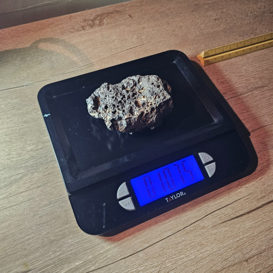 Meteorite rock item is a pitted unknown from Mohave desert 10.75- sample stone.