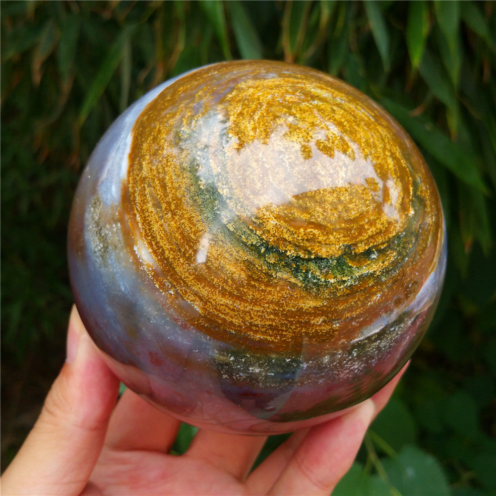 Crystal carved ball of Ocean Jasper