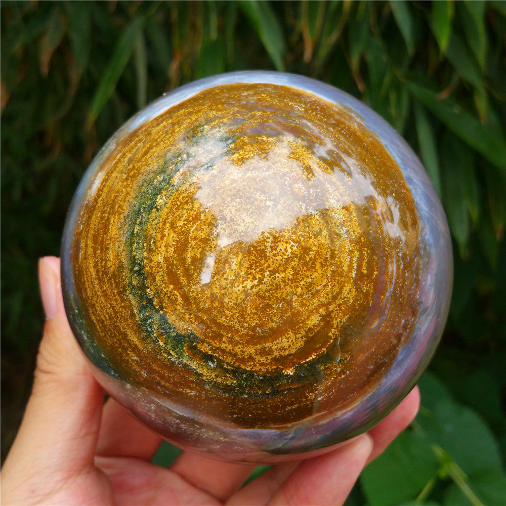 Crystal carved ball of Ocean Jasper