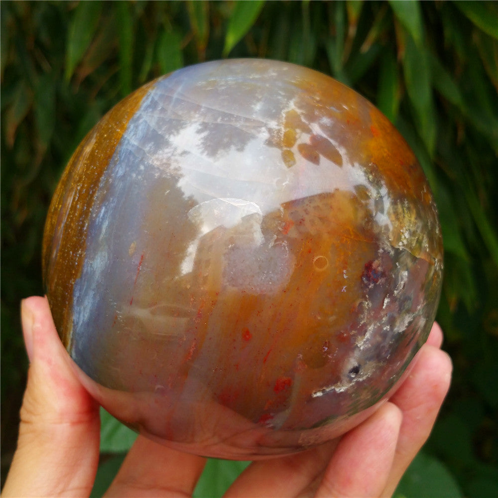 Crystal carved ball of Ocean Jasper