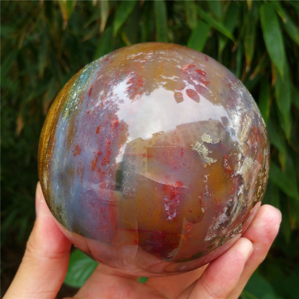 Crystal carved ball of Ocean Jasper