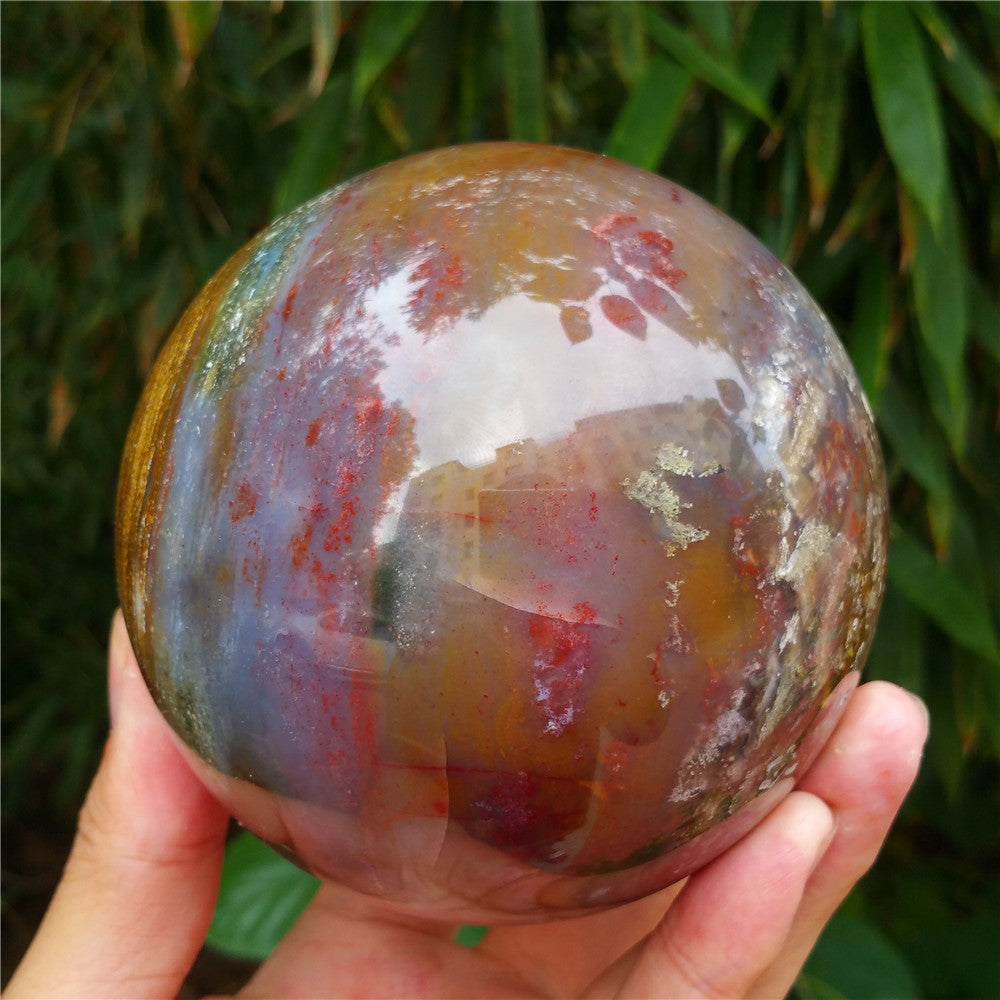 Crystal carved ball of Ocean Jasper
