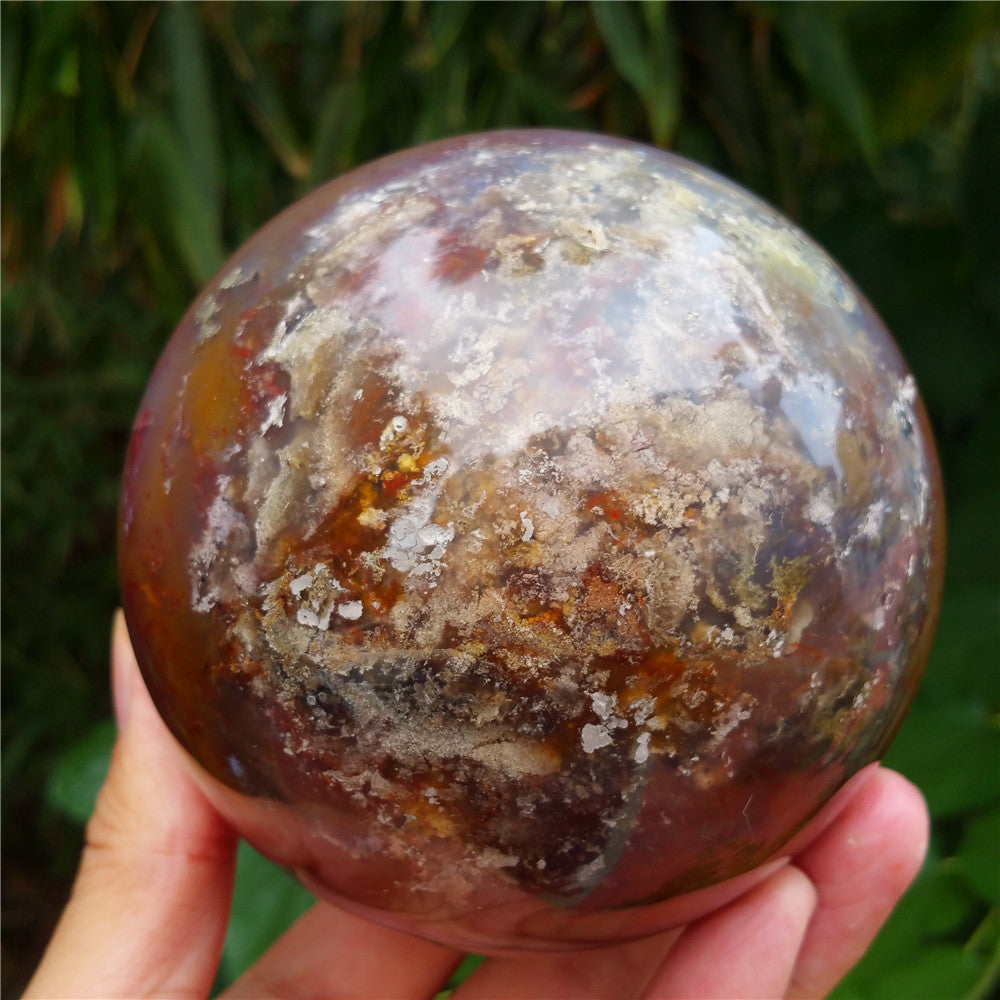 Crystal carved ball of Ocean Jasper