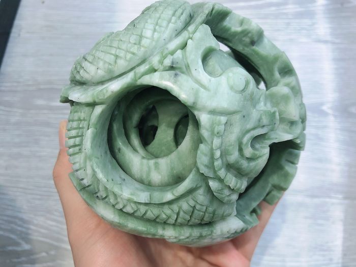 The exquisite Xiuyu jade carving feng shui ball in the east