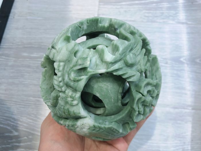 The exquisite Xiuyu jade carving feng shui ball in the east